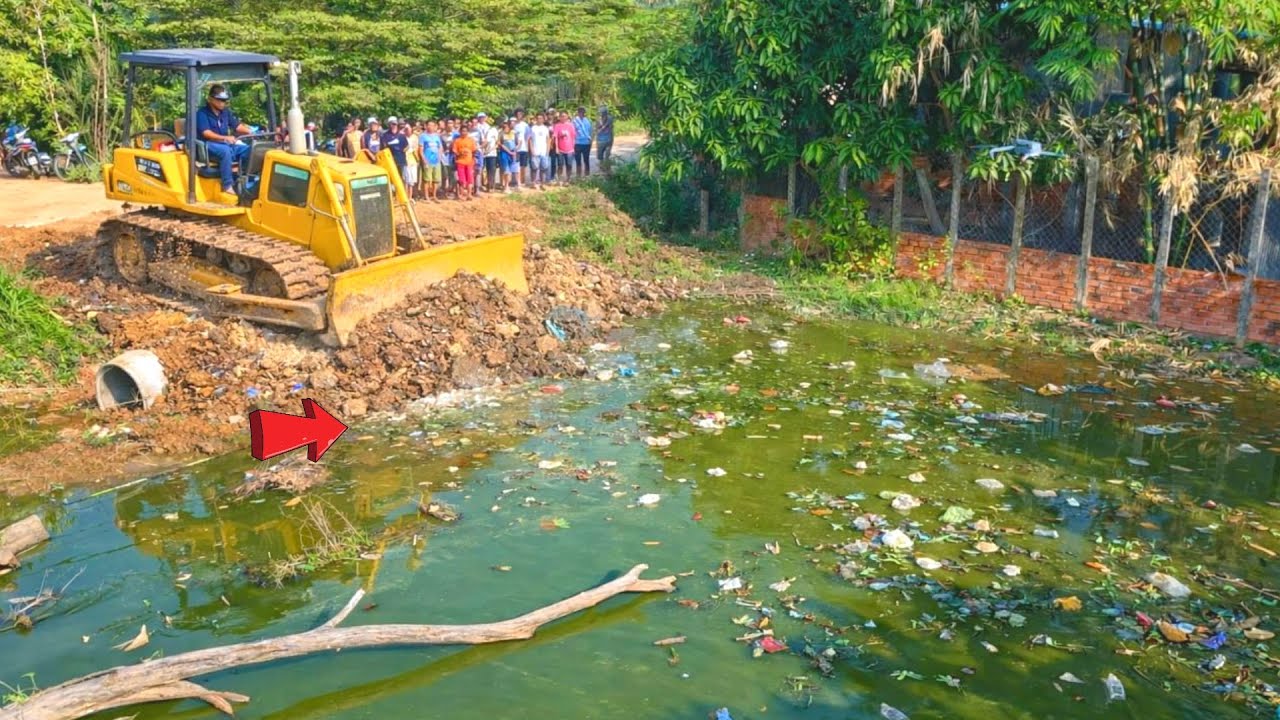 Great new project!! Complete 100% clearing, pushing soil, garbage in water the houses by Bulldozer