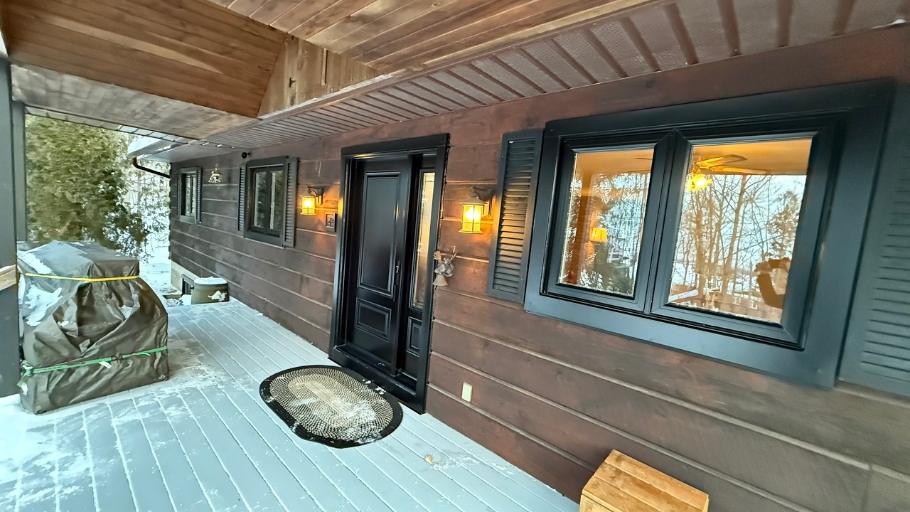 New windows and doors for this beautiful wood house.