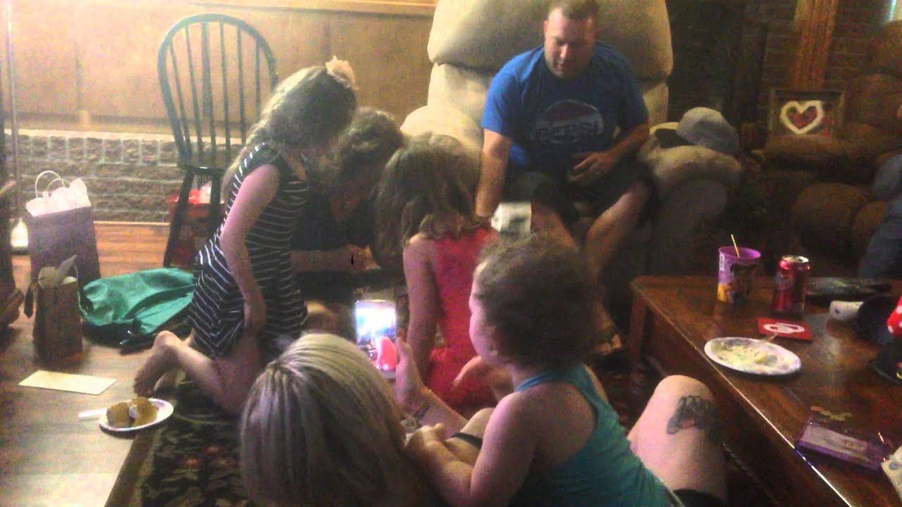 Lisa Cornett opening up a birthday present - containing a live hamster.