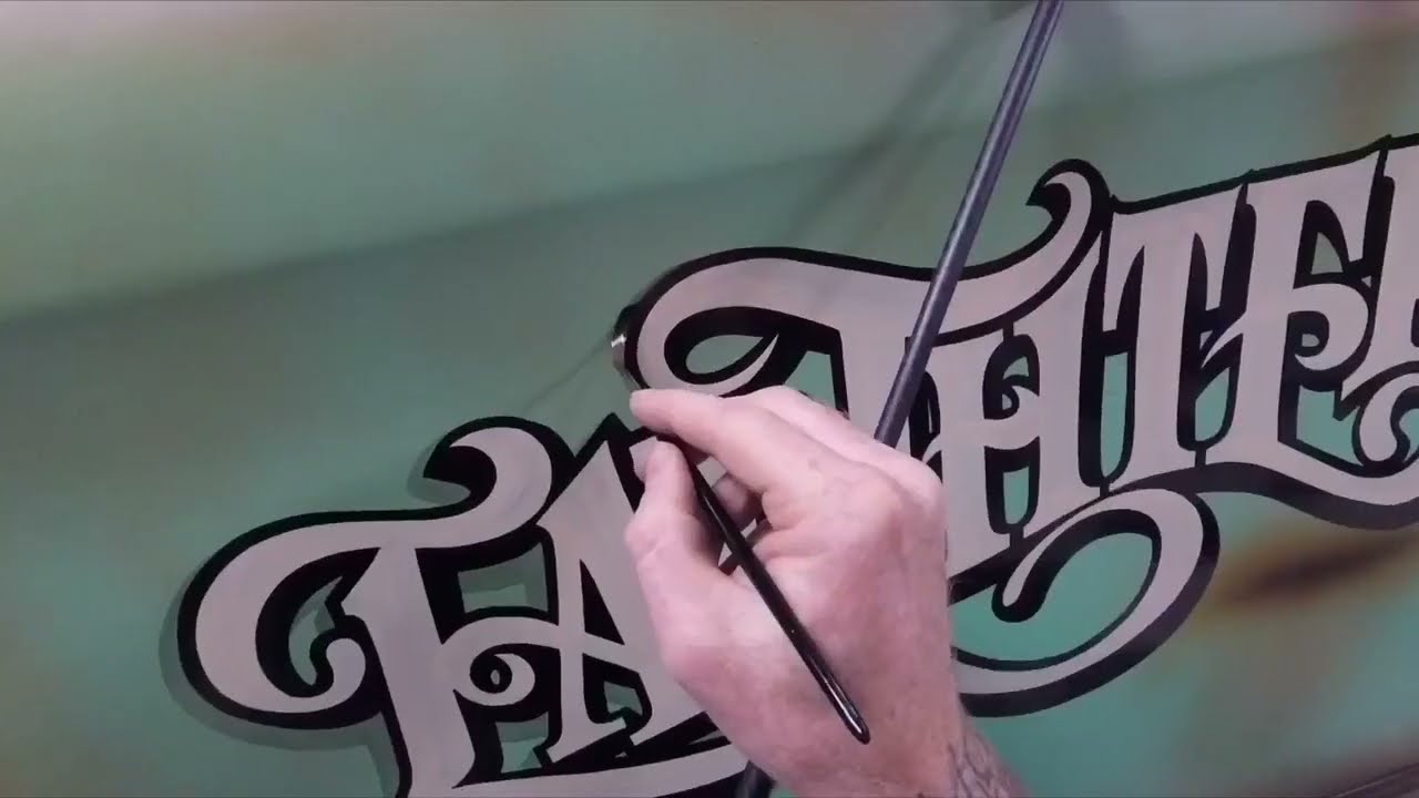 Mat egan hand painting  distressed lettering and pinstriping