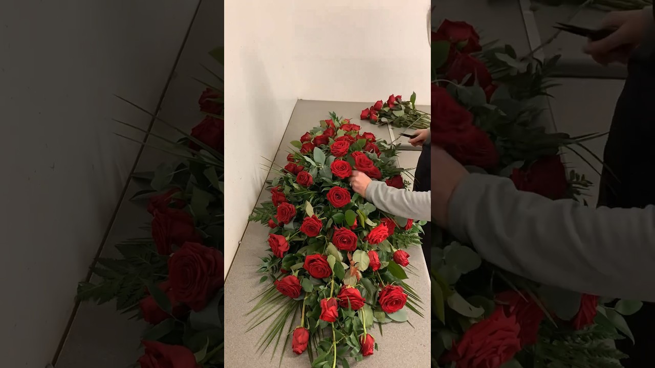A tribute of stunning red roses and foliage #coffinspray #funeralflowers #redroses #lovedones
