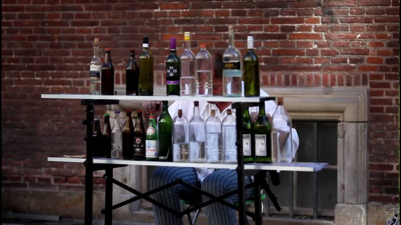 Amazing guy playing Mozart on wine bottles