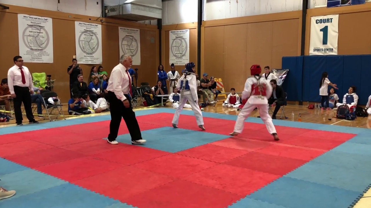 Taekwondo Varsity Tournament - Khang Ho - Fight Two 4-22 Blue