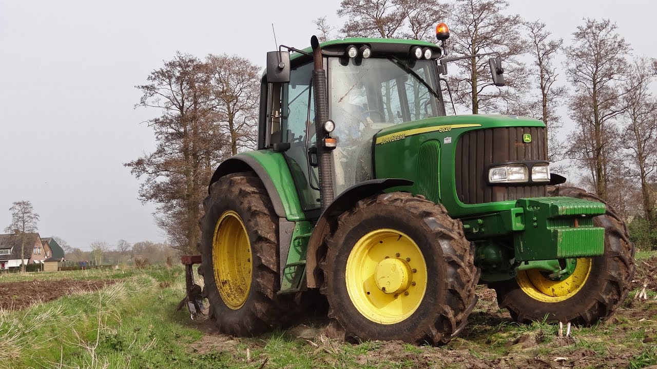 John Deere 6620 | HekAmp cultivator | Lunteren along the highway A30 | Nederland.