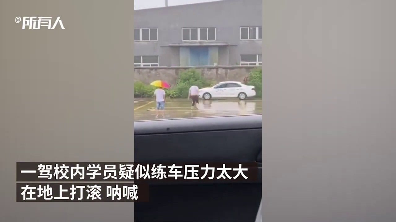 Rookie driver breaks down and rolls on the ground after failing driver's license test multiple times