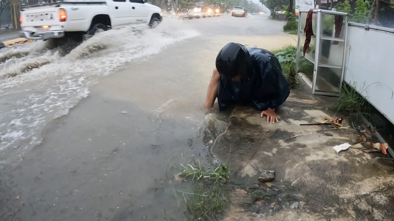 Flood relief activities on the street after heavy rainstorm