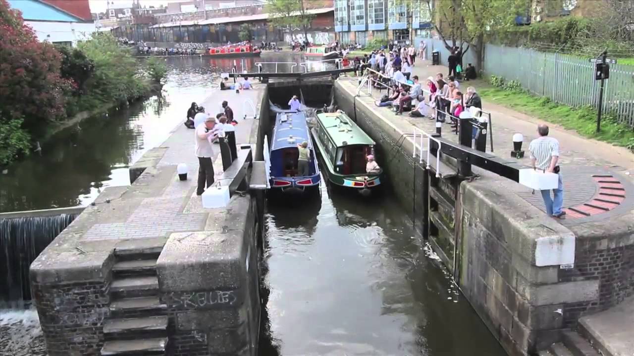 Narrowboats pass through Camden Locks in London
