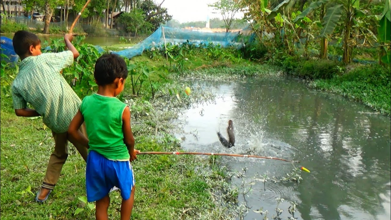 Yes! boy catching big catfish by hook (chotu)