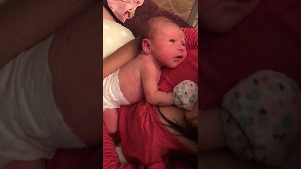 Newborn baby spits up after eating