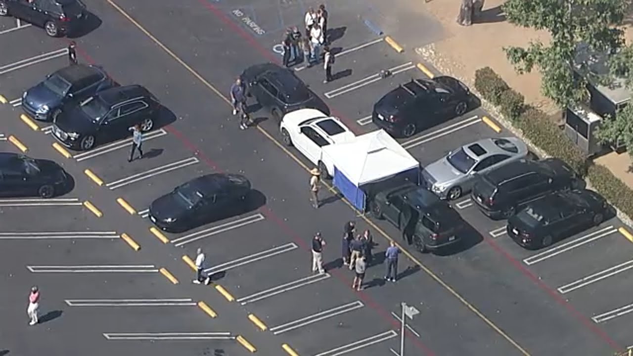 Teenager dies after being pinned between 2 SUVs in school parking lot