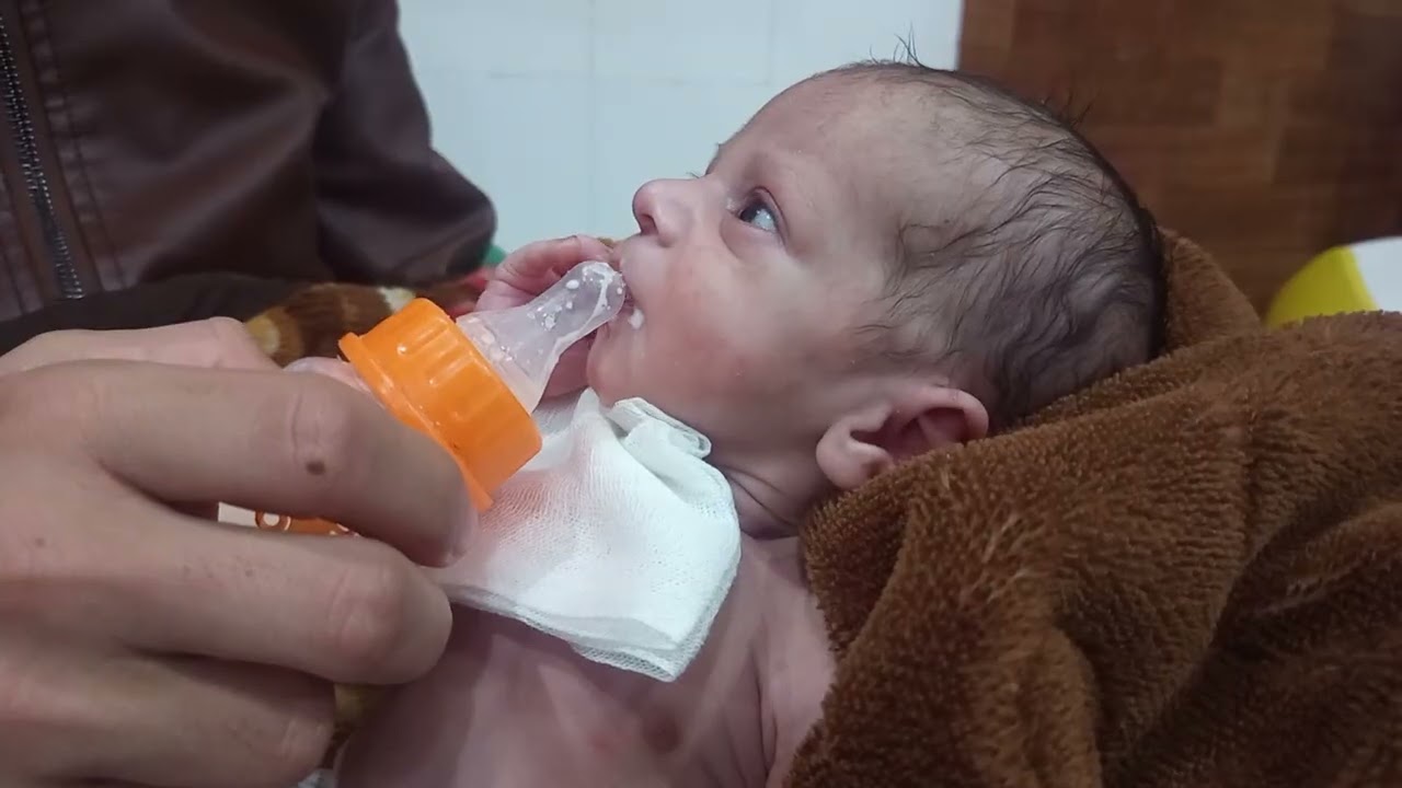 Bottle feeding to a nice baby .He enjoy bottle feeding.