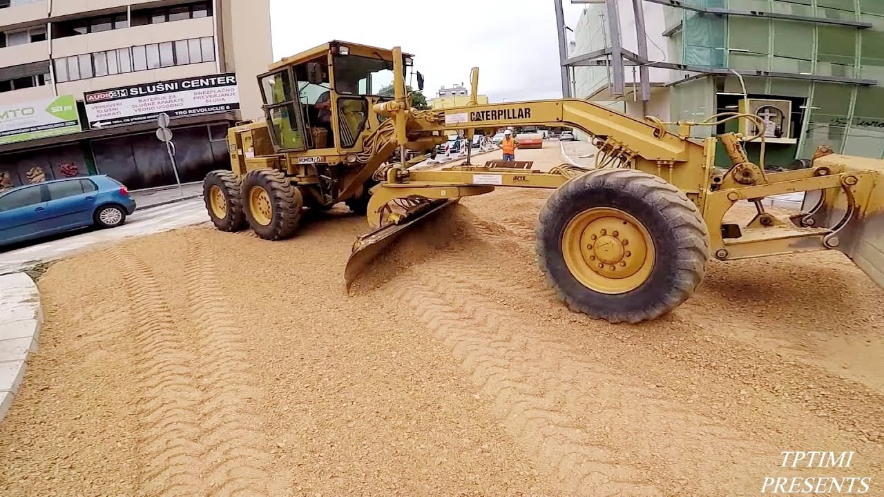 Motor Grader Grading The First Half Of A Roundabout - Skilled Operator
