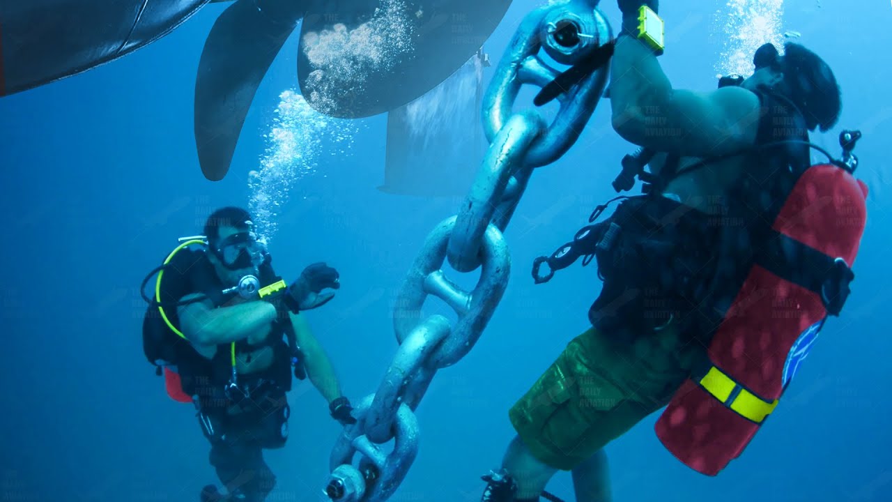 Skilled US Navy Divers Perform Scary Propeller Inspection Underwater