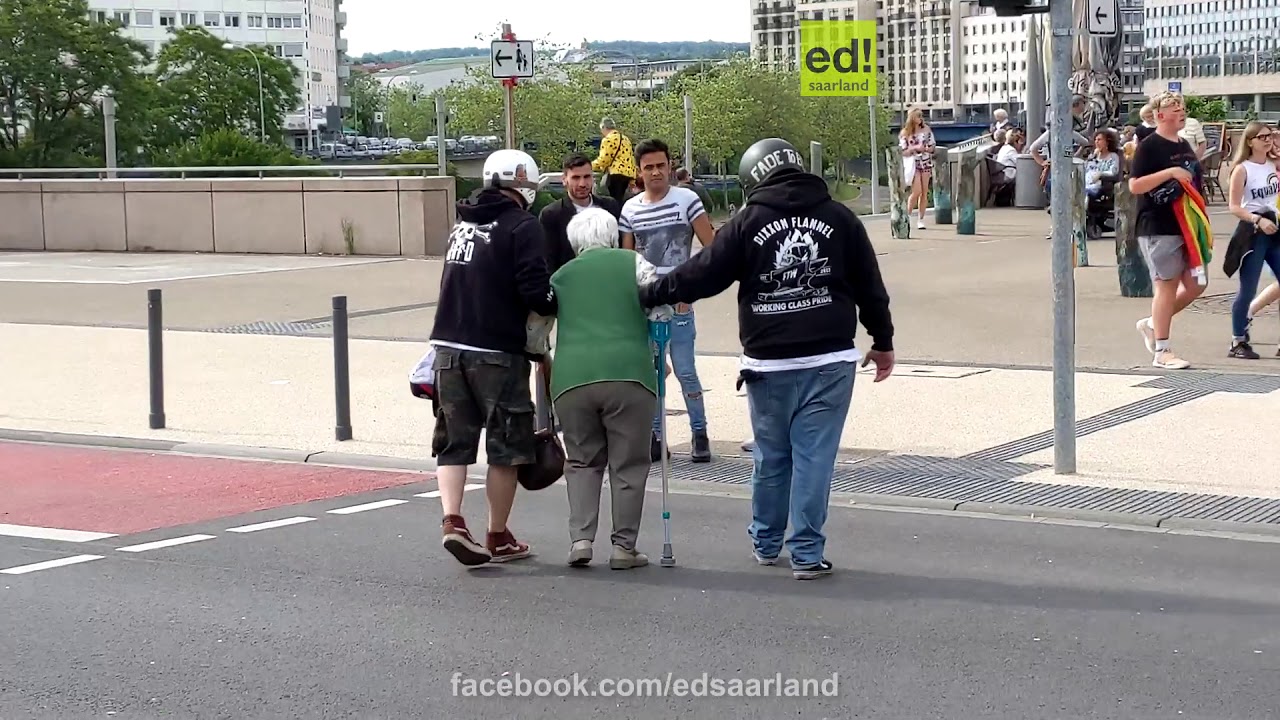 German Motorcyclists block intersection and help grandma across the street.