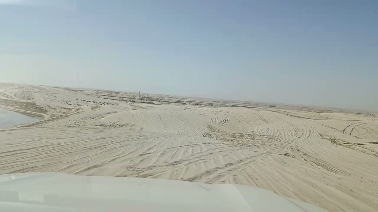 Dunebashing. Doha desert safari inland sea Qatar 