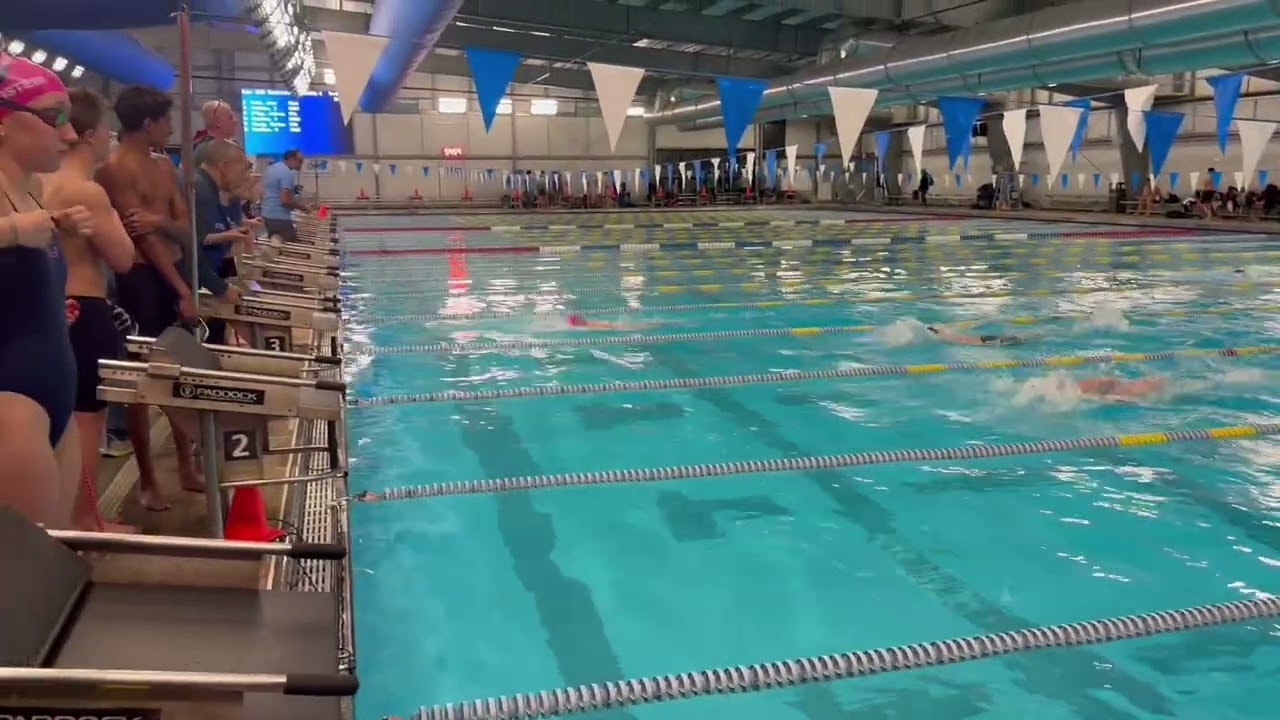 Tirian Chang wins the 100 backstroke for Chatham vs. Mendham
