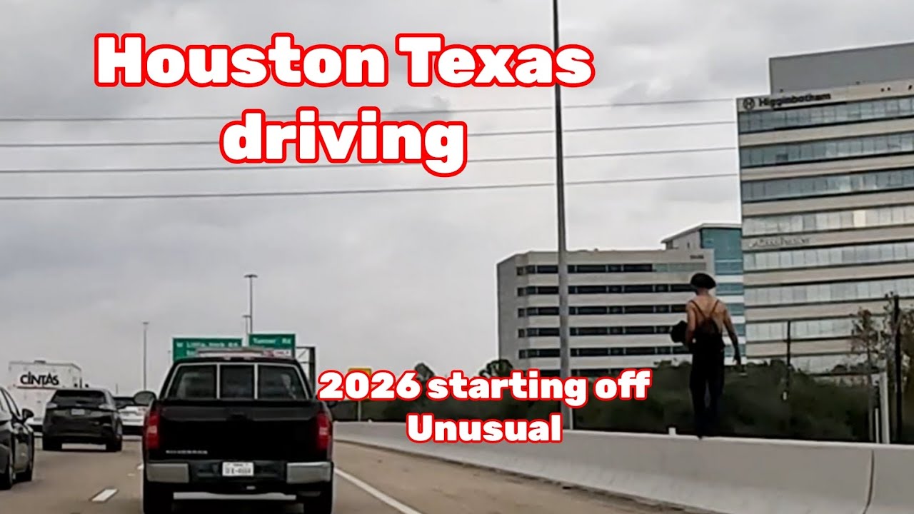 Houston Texas driving 1/8/26 is that a man on the top of the wall?