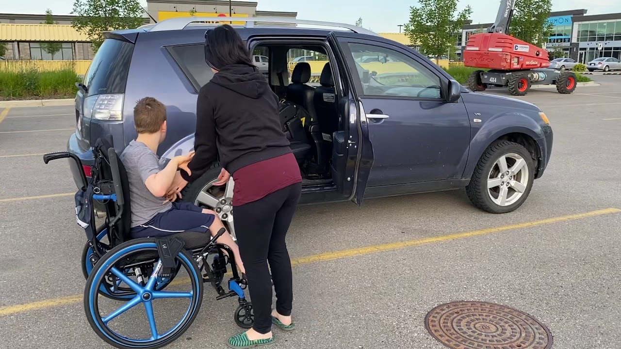 Transferring child with cerebral palsy to vehicle