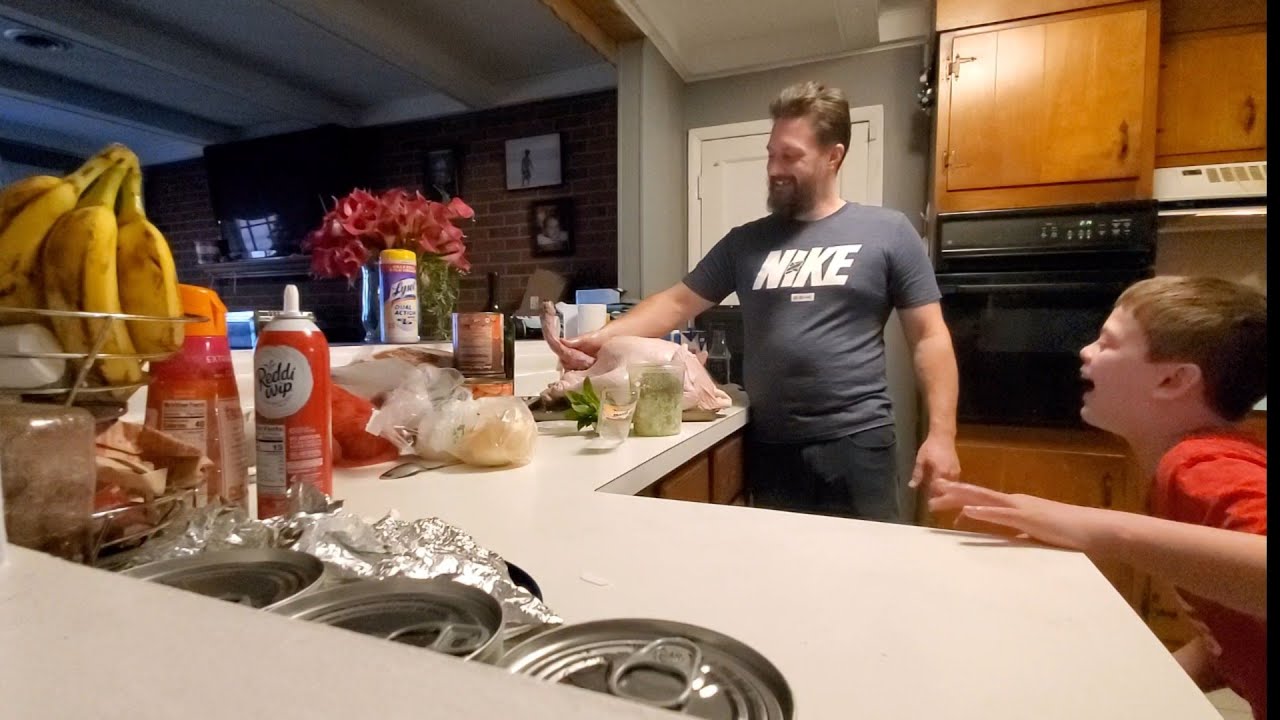 The kids find out if it's a male turkey.  Prepping the turkey before Thanksgiving