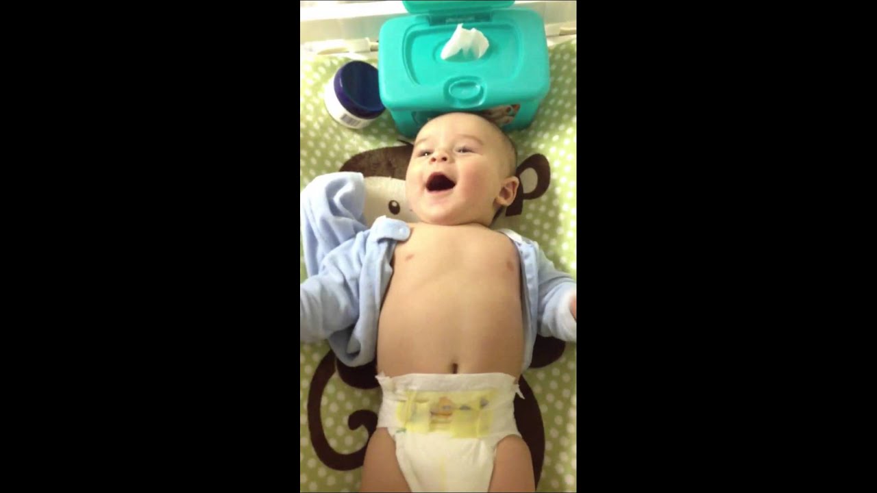 Laughing on the changing table