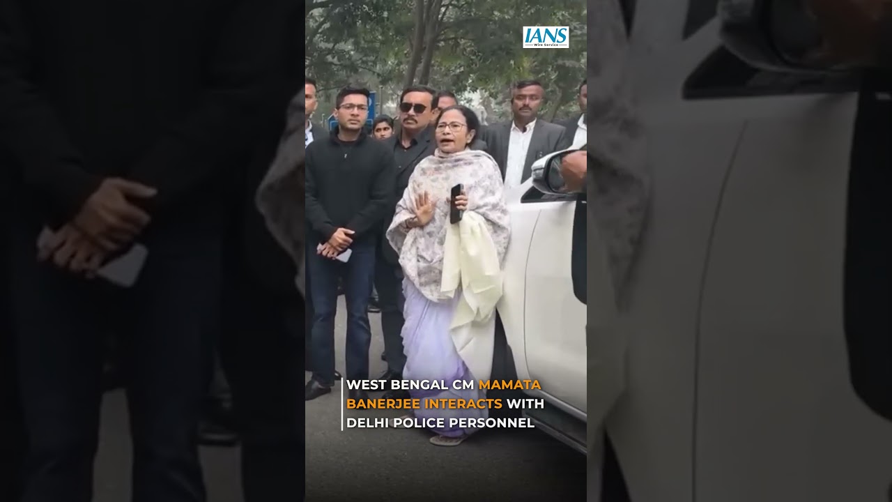 West Bengal Chief Minister Mamata Banerjee interacts with Delhi Police personnel