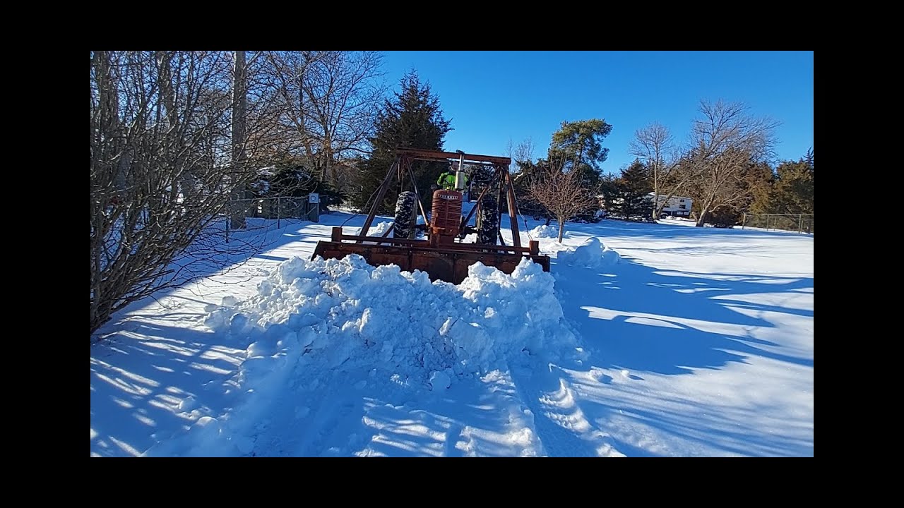 Farmall H unstuck and moving snow