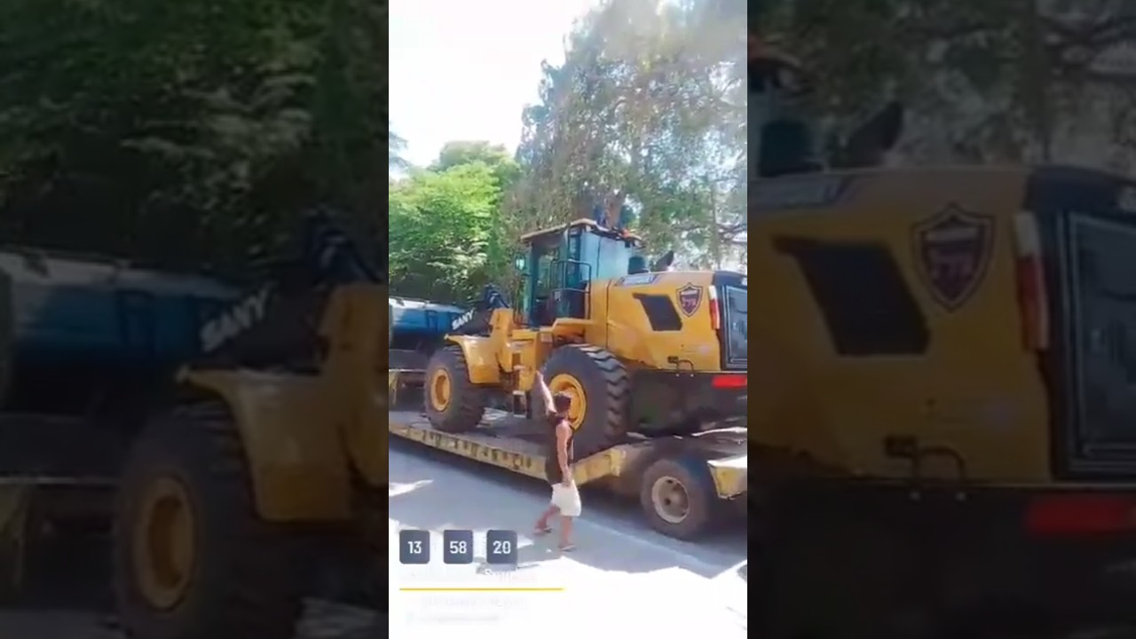 Unloading from Lowbed trailer truck a massive Sany Wheel Loader SW956K1