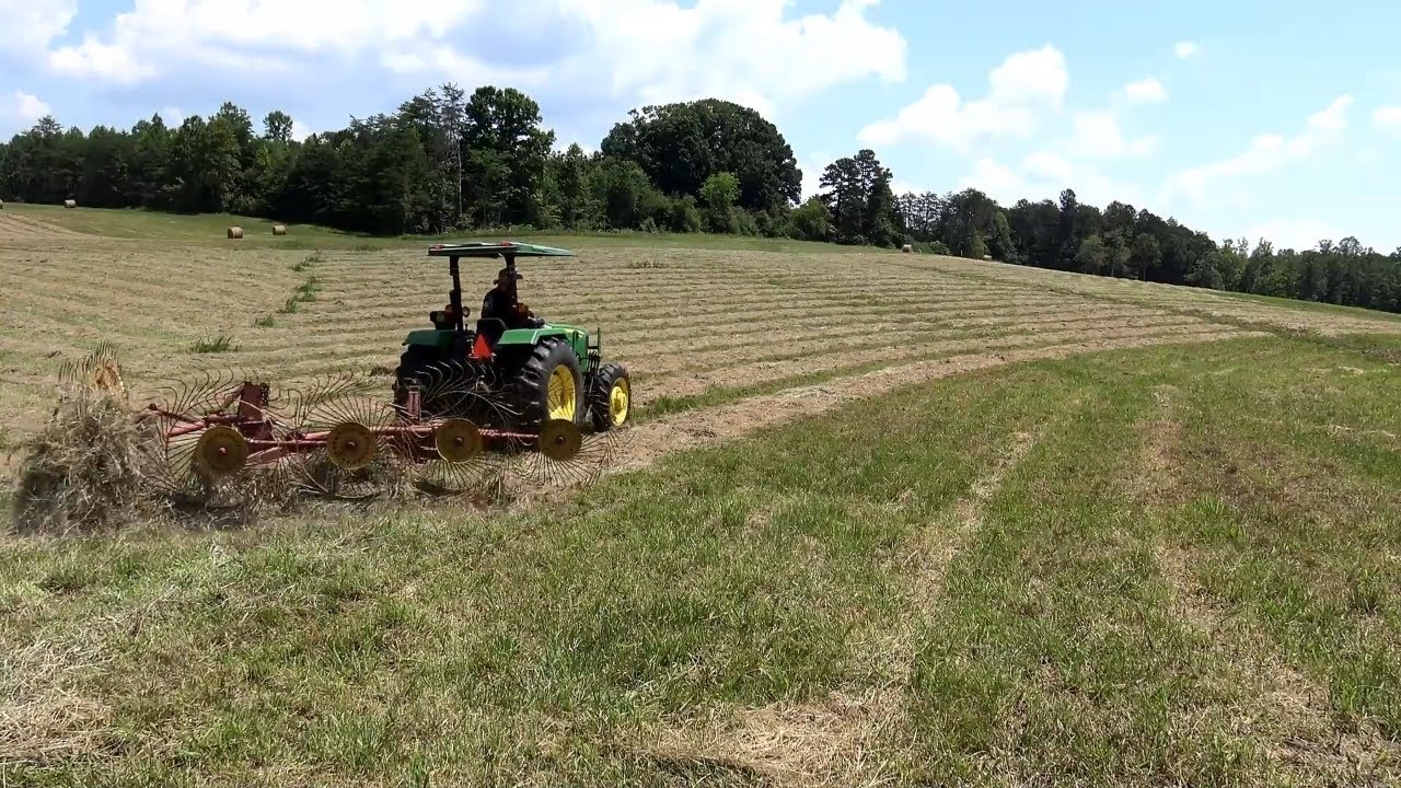 Cutting and Raking Hay on This new Farm!