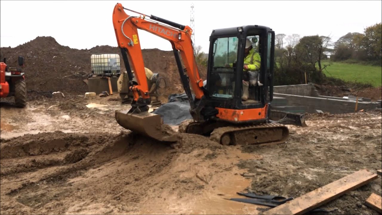 Mini Excavator working with very wet mud.