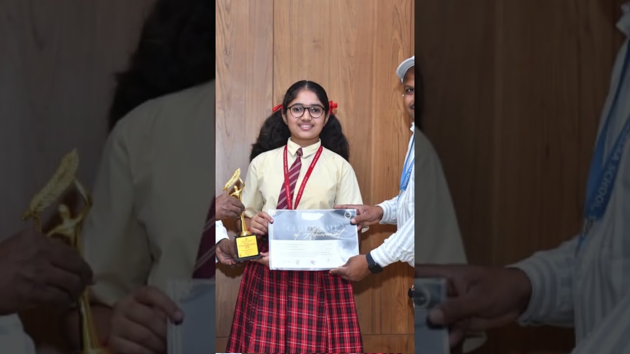 Displaying trophies & beautiful prizes from Rangotsav Celebration for Chavara High School