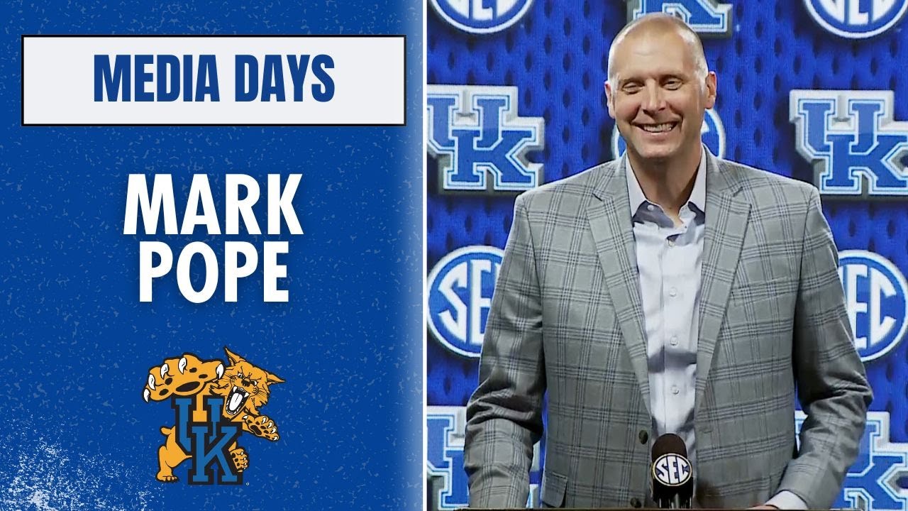 Mark Pope at the podium at SEC Media Days