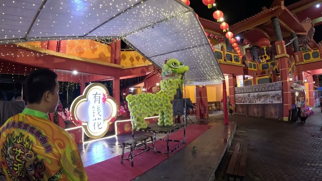 lion dance crowd play and table performance at temple