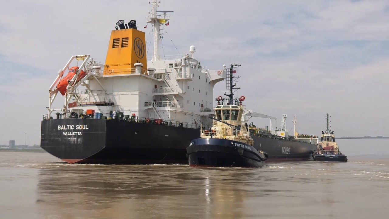 Ship berths at fuel terminal on river Thames