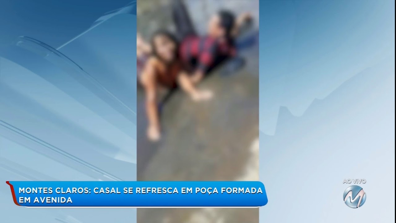 Montes Claros: casal se refresca em poça formada em avenida