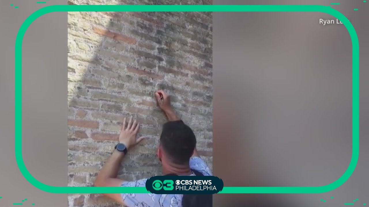 Tourist filmed carving his fiancée's name onto Roman Colosseum: 