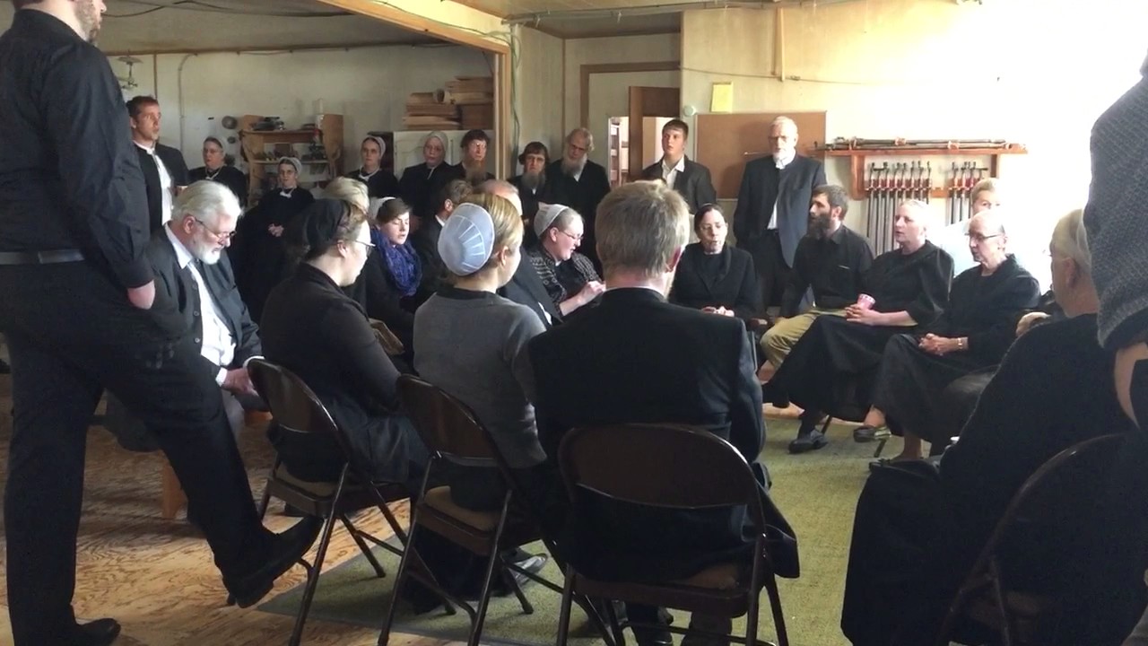 Singing after an Amish funeral in Lancaster County, PA. Descendants are singing, mostly non-AMISH.