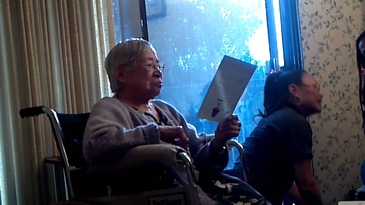 Grandma Wu reading her 94th Birthday Card