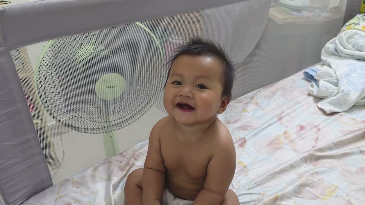 8 months old kid playing in safe kid cage  peacefully 