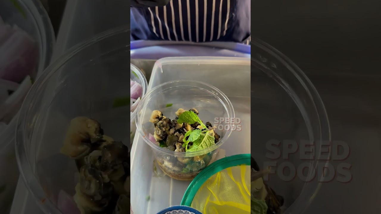 Golden apple snail lemon salad in Thailand
