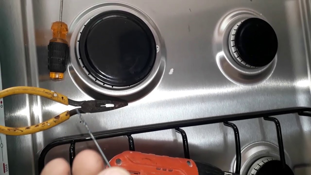 cambiar espreas de gas lp o butano para gas natural Perforando inyectores en estufa de cosina