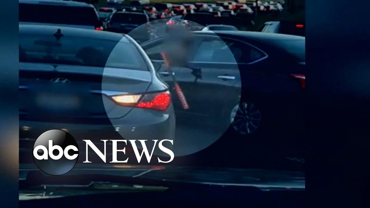 Video shows violent confrontation between drivers in the middle of rush hour traffic | ABC News