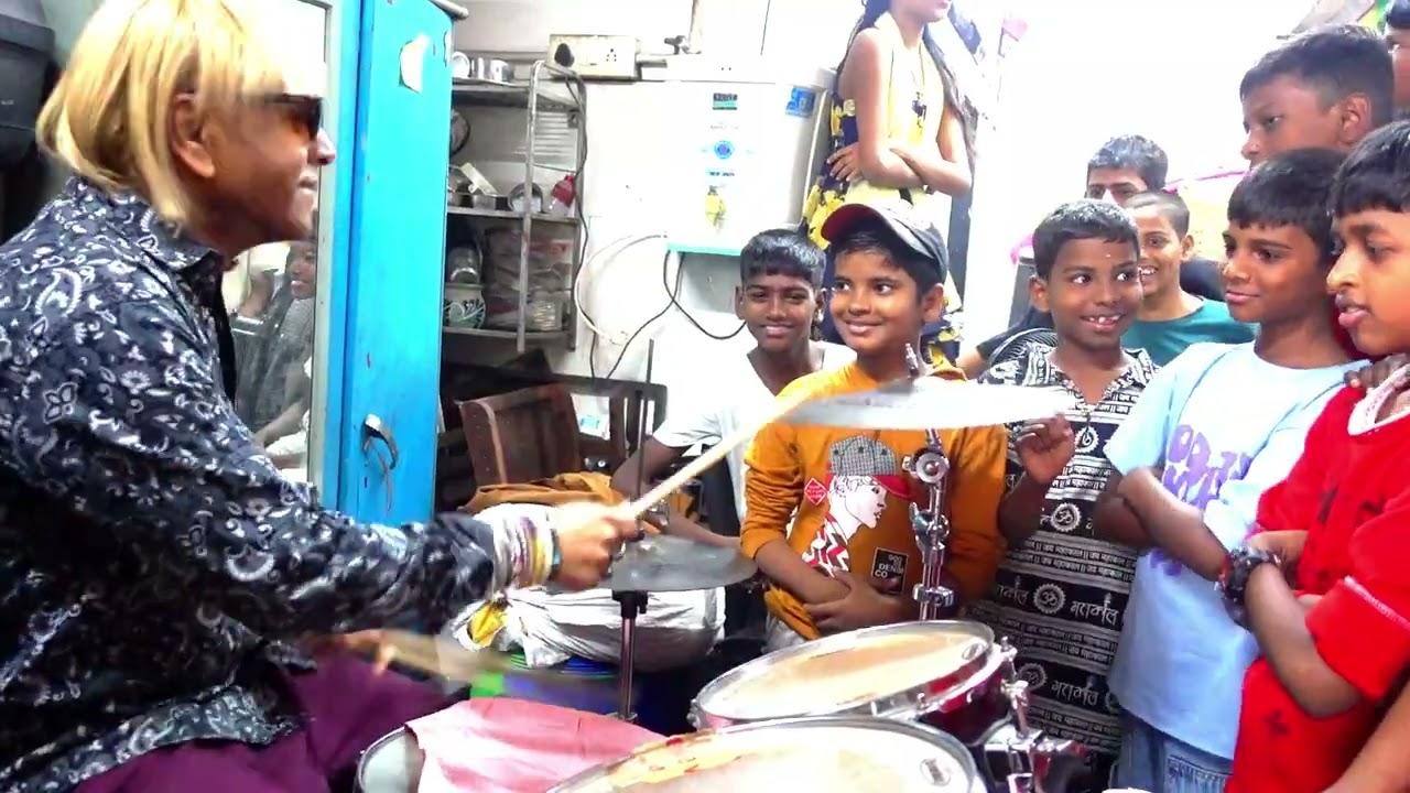 GLENN PERRY IN MUMBAI INDIA TEACHES DHARAVI SLUM CHILDREN LESSONS IN DRUMMING...