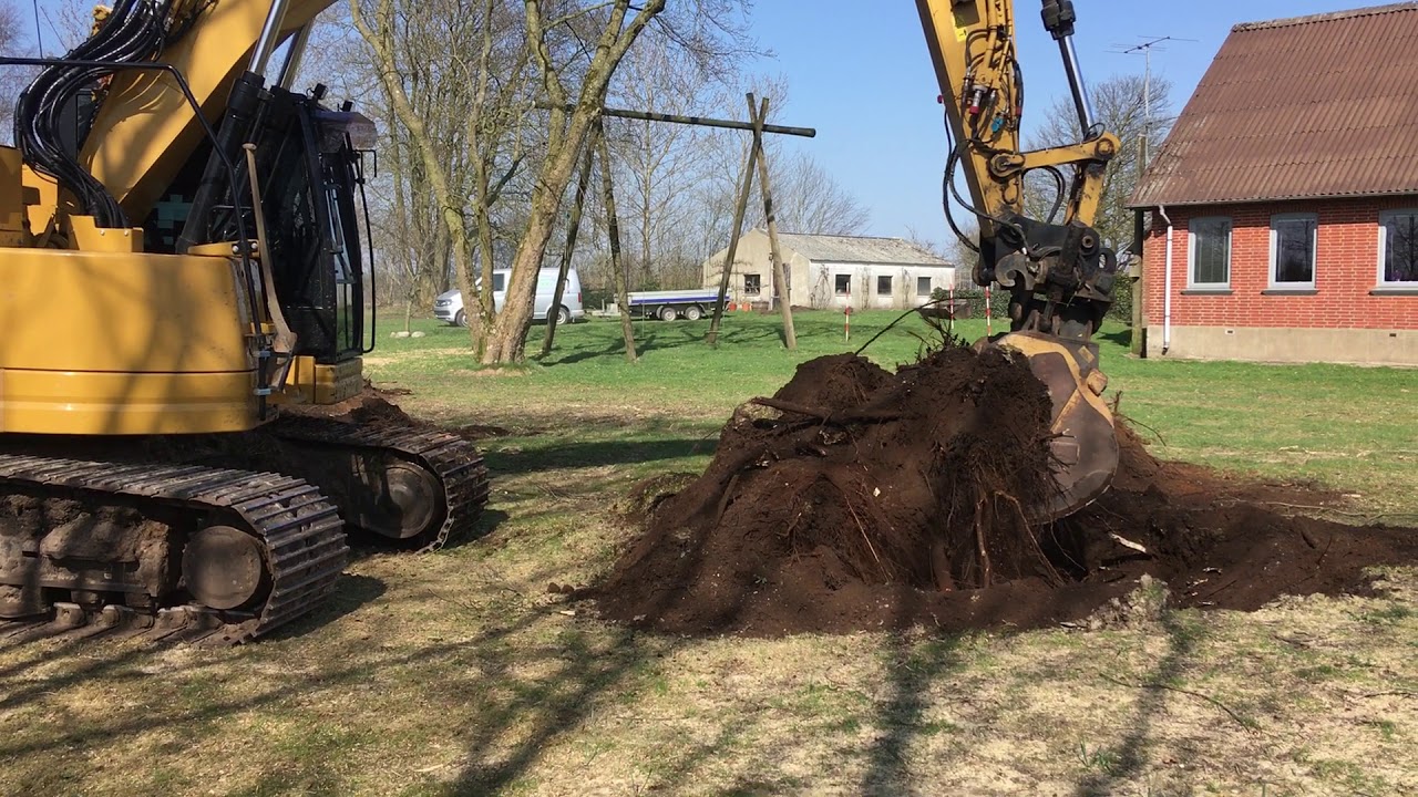 Cat 325F graver træer op