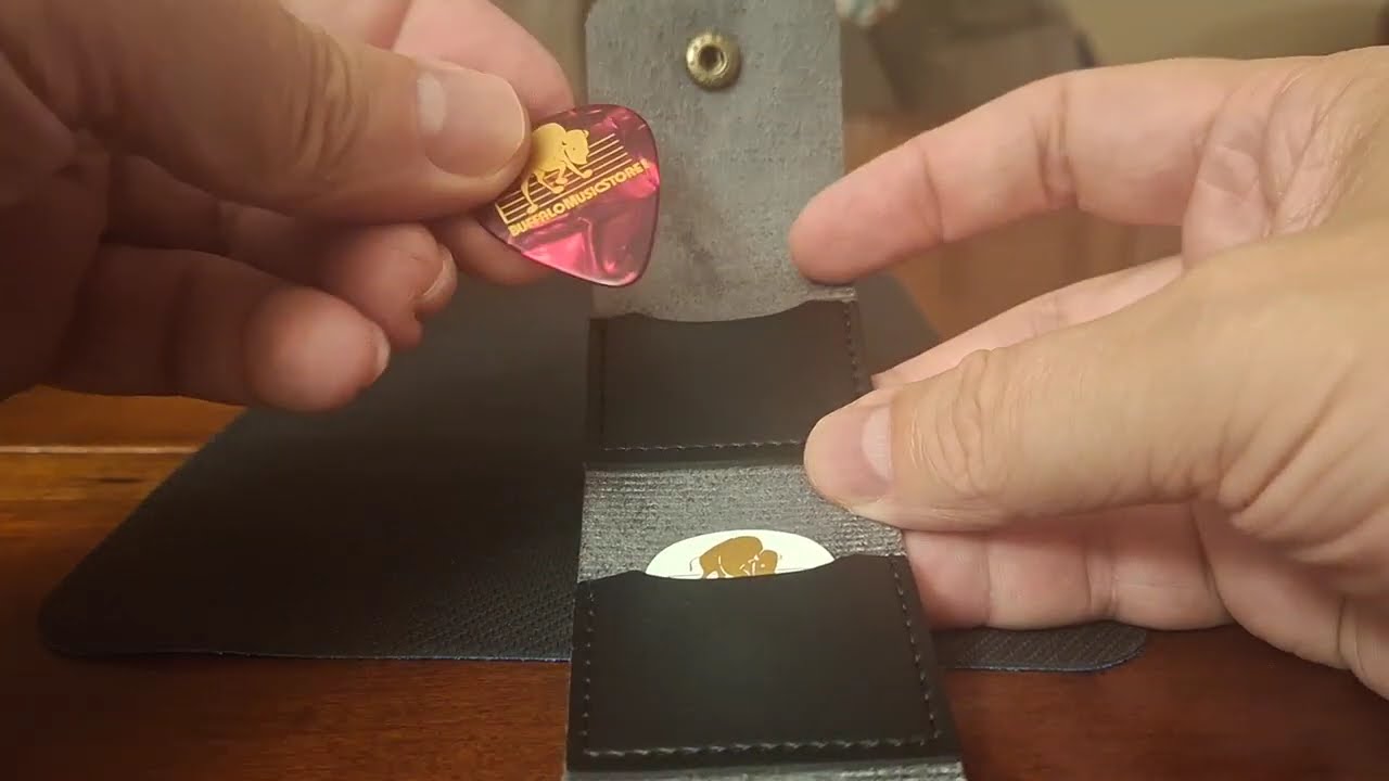 Guitar pick pouch with Buffalo Music Store picks.