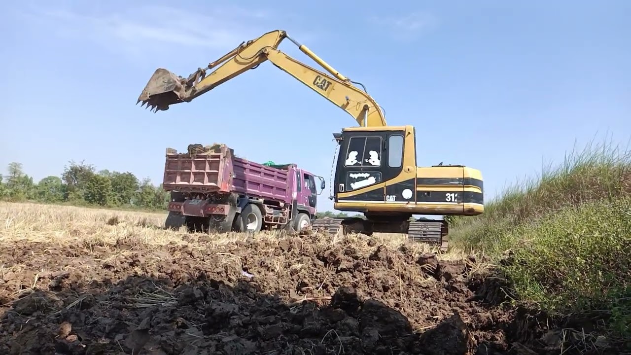 Machinery group - Three Caterpillar 352F & Liebherr 964 Excavators Working At Massive Mining Site