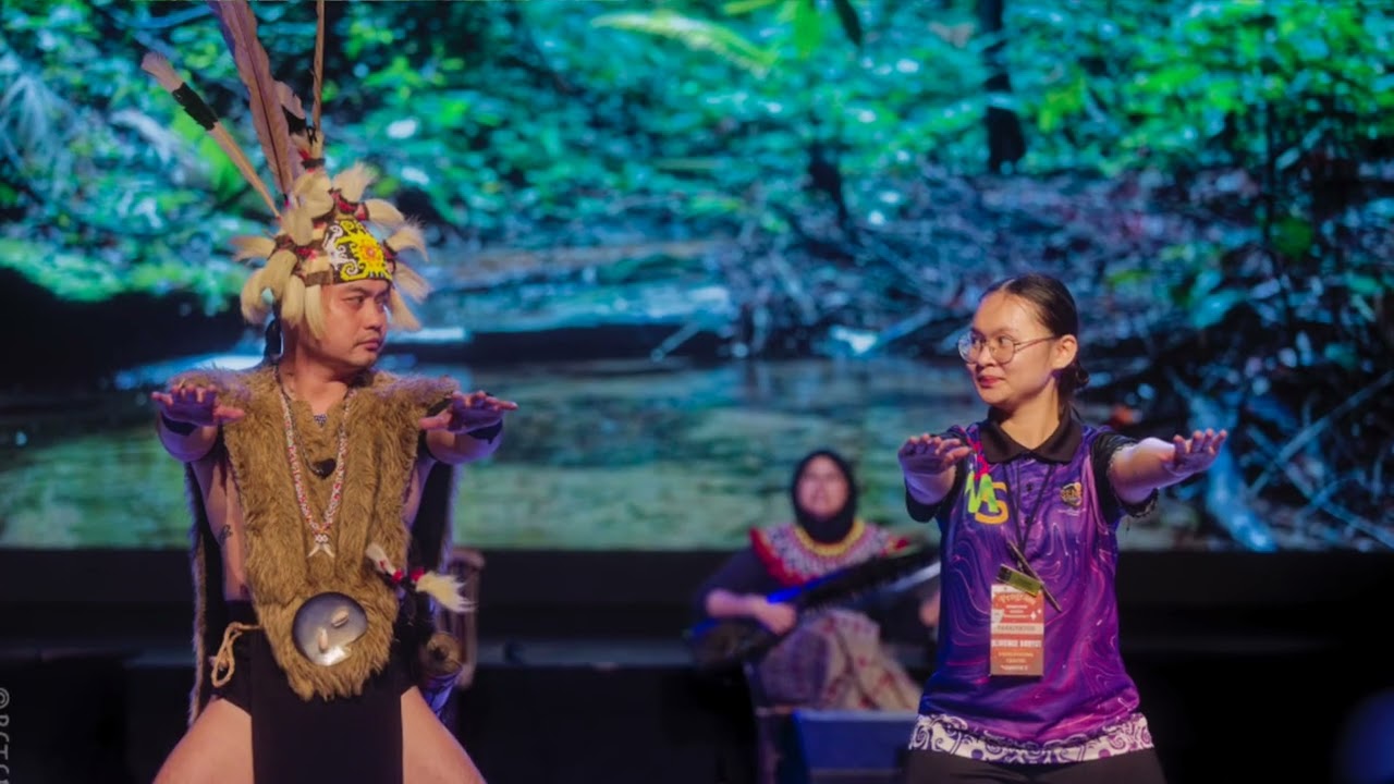 Iban Warrior with his blowdart at the Sarawak Cultural Village show