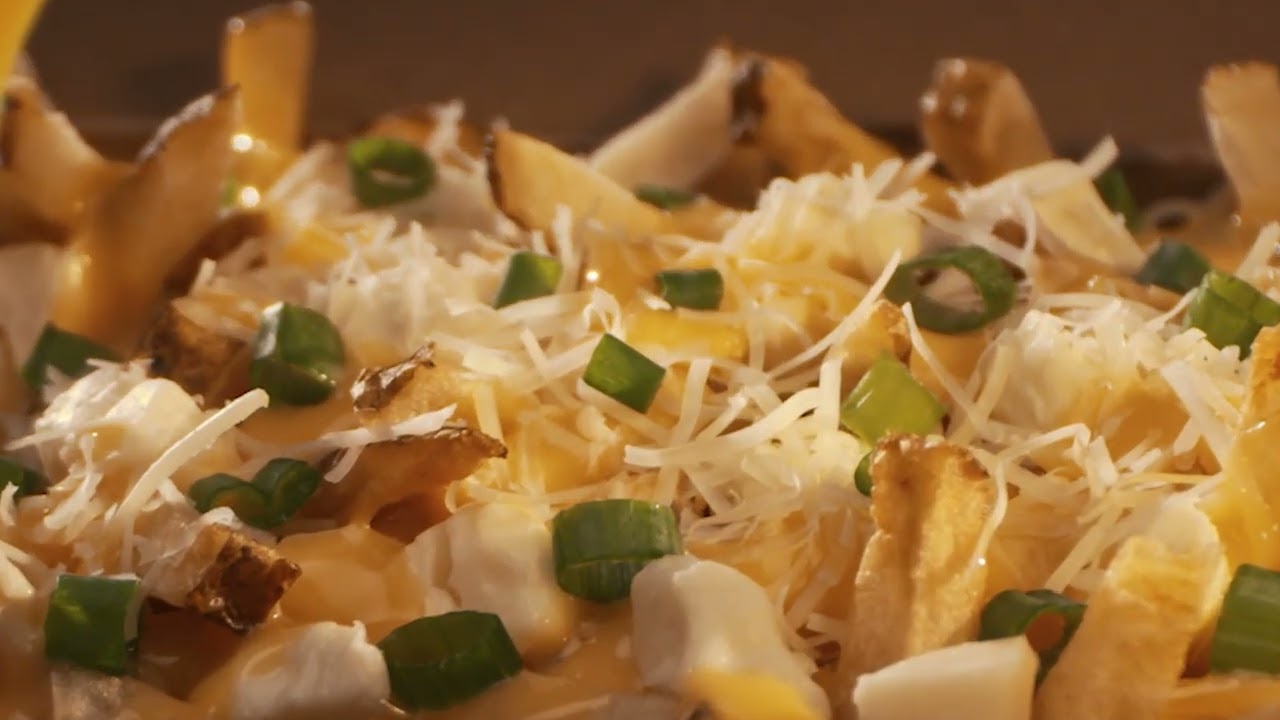 Triple Cheese Poutine: Cheese Curds, Cheese Sauce & Parmesan Cheese