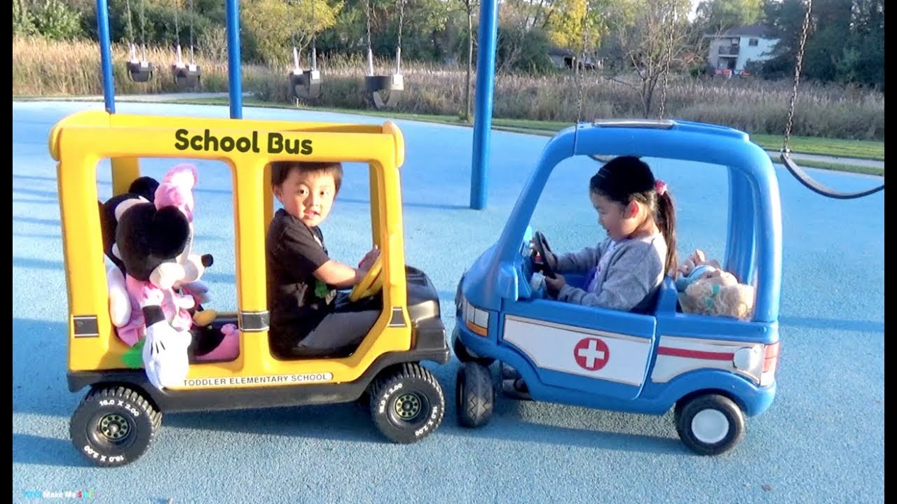 Riding School Bus and Ambulance Ride On Cars at the Playground