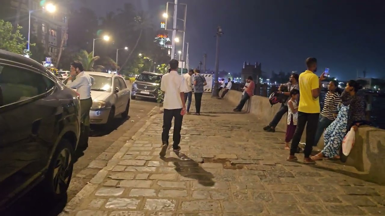Colaba.Mumbai.Nearby Taj palace hotel.Gateway of India. Night view.Walking along footpath 