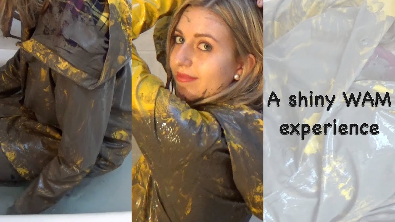 Blonde girl wet and muddy in raincoat, leather leggings and leather boots